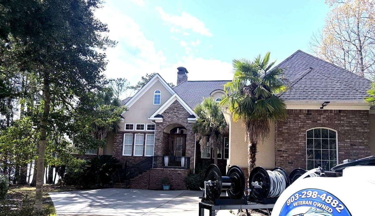 Bub's Pressure Washing crew softwashing a South Carolina home