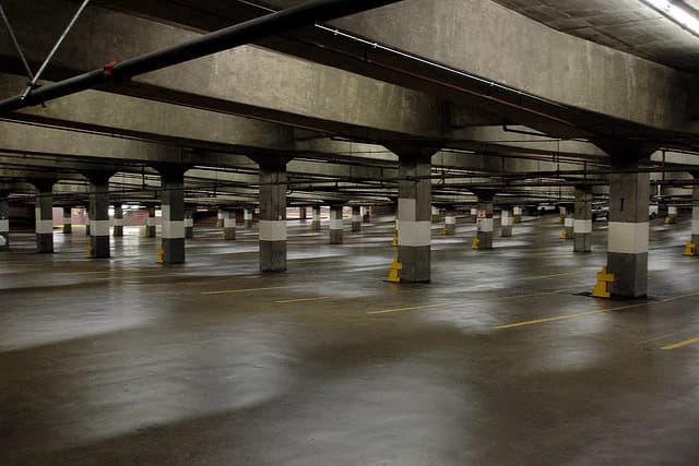 Multi-level parking garage deck, the kind of concrete surface we clean and de-grease for commercial properties
